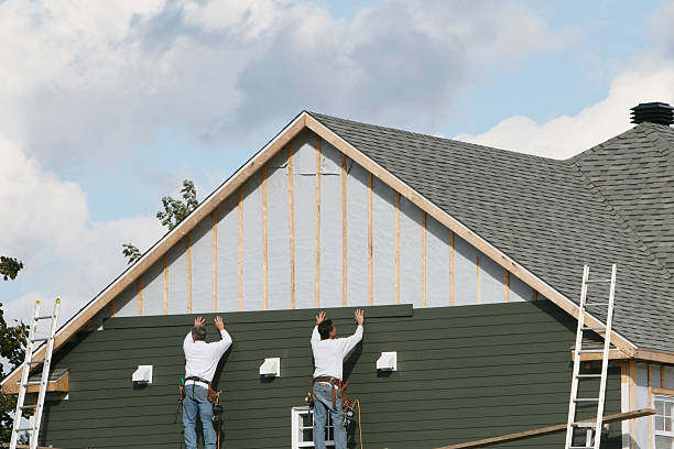 Professional Siding Installation technician working in Seville, FL